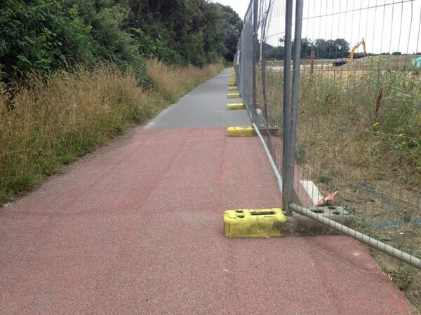 The photo for Contractor's fencing part-blocking cycle path.